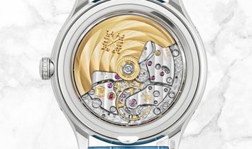 Patek Philippe Complications 4947G-010 Annual Calendar Moon Phases White Gold Silvery Dial