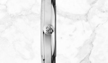 Patek Philippe Calatrava 5297G-001 Date Sweep Seconds in White Gold Diamond Bezel Black Dial