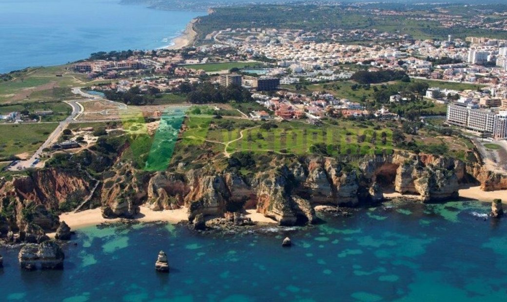 Land With Ruin On Top Of Dona Ana Beach In Lagos, Algarve, Portugal For