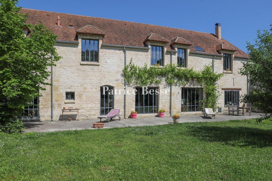 A Watermill's Old Outhouse With A Garden In A In Vert, île De France
