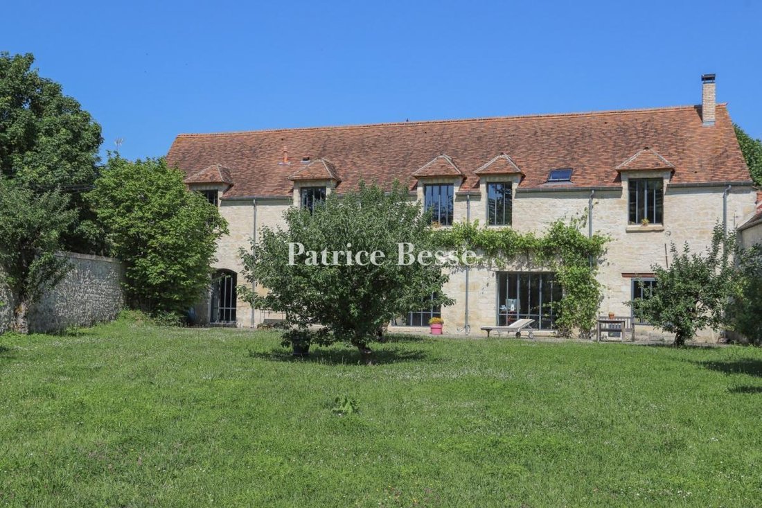 A Watermill's Old Outhouse With A Garden In A In Vert, île De France