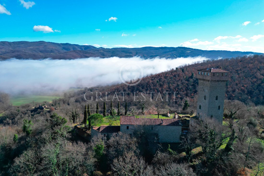 Whispers of Umbria: A Castle Crowned by Lake Trasimeno’s Golden Light