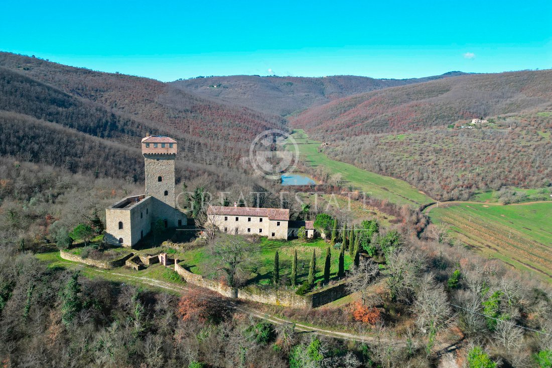 Whispers of Umbria: A Castle Crowned by Lake Trasimeno’s Golden Light