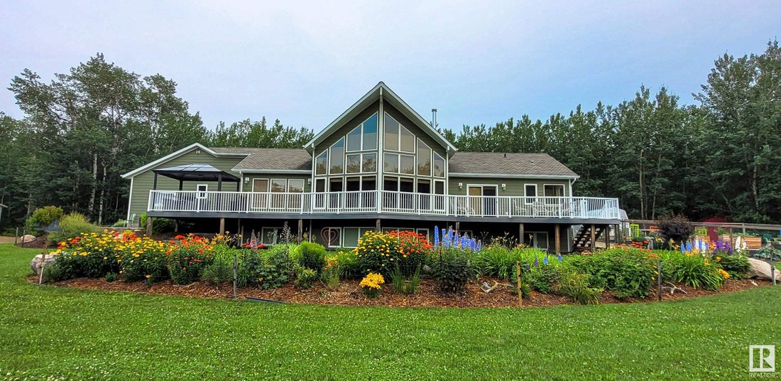 Immaculate Bungalow Surround By Lush Forest And In Tofield, Alberta