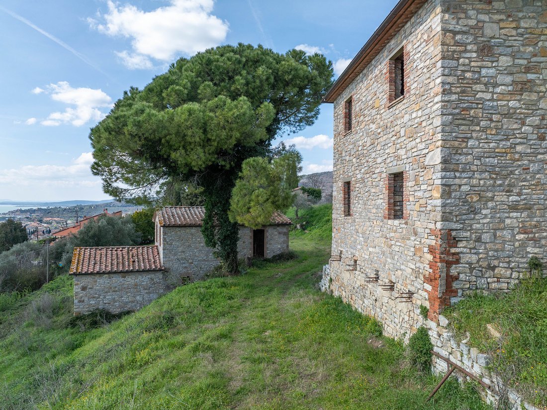 Whispers of the Middle Ages: A Lakeside Castle Crown in Umbria’s Golden Light