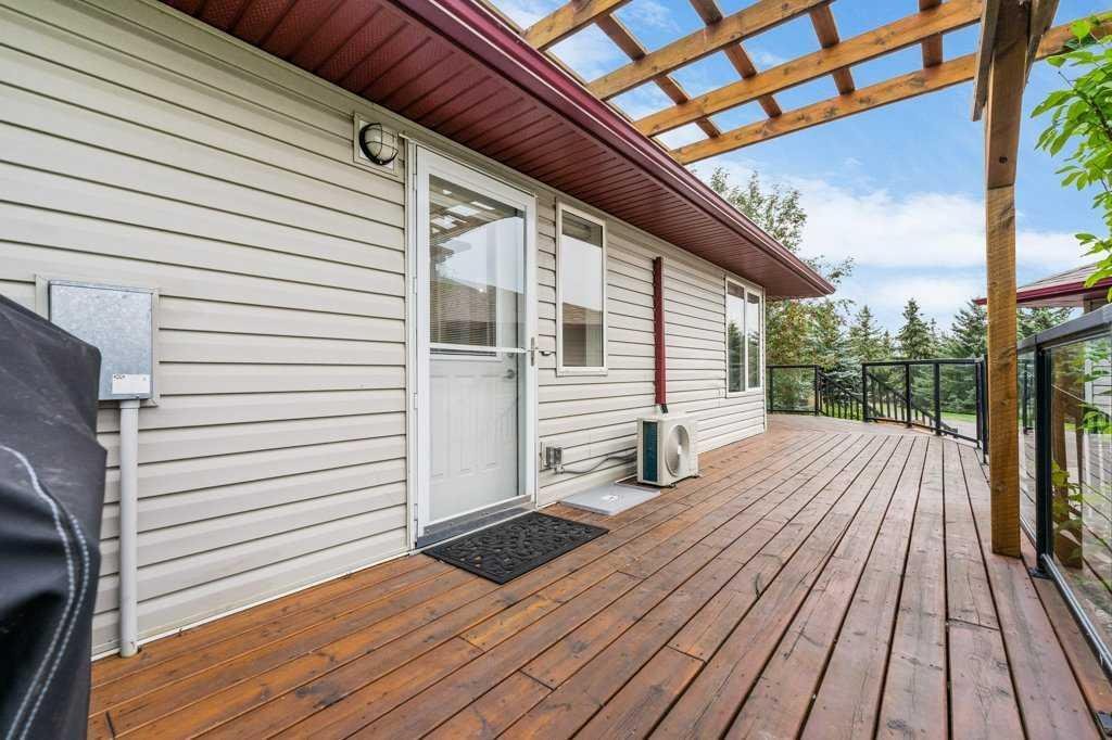 Meticulously Maintained Bungalow On Over Nine In De Winton, Alberta