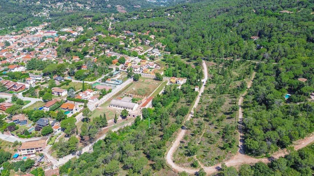 Catalonia’s Crown: A Visionary Canvas Above Aiguafreda’s Verdant Hills