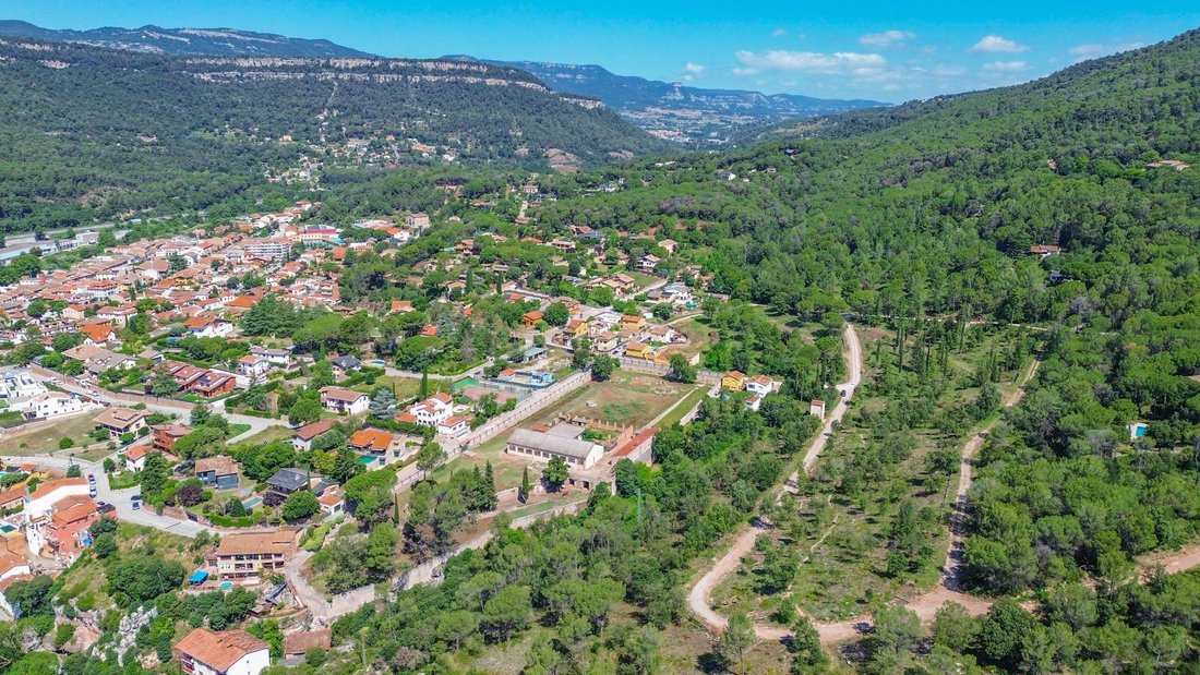 Catalonia’s Crown: A Visionary Canvas Above Aiguafreda’s Verdant Hills