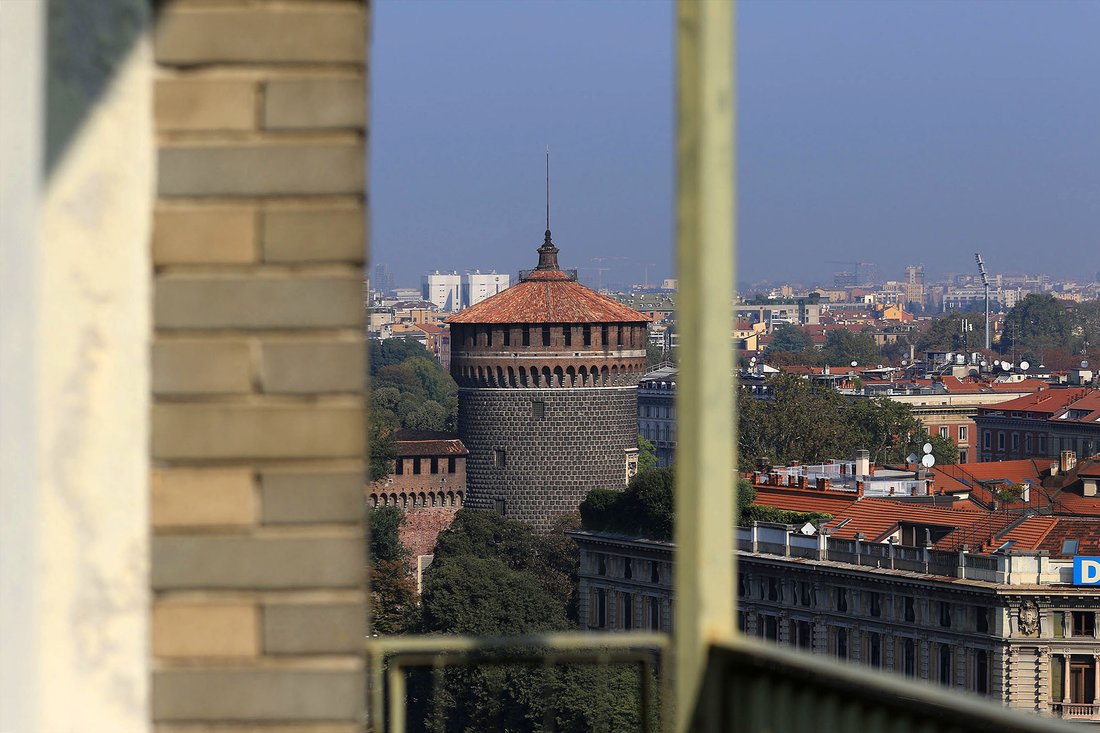 The Sforza Skyline: A Glass Jewel Crowned by Milan’s Castle Views