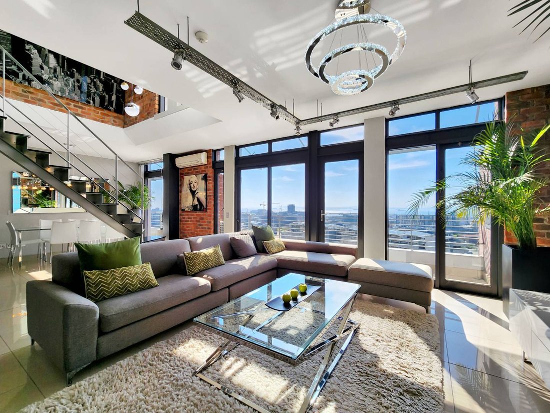 View of Inside a chic, industrial-inspired penthouse loft with skyline views