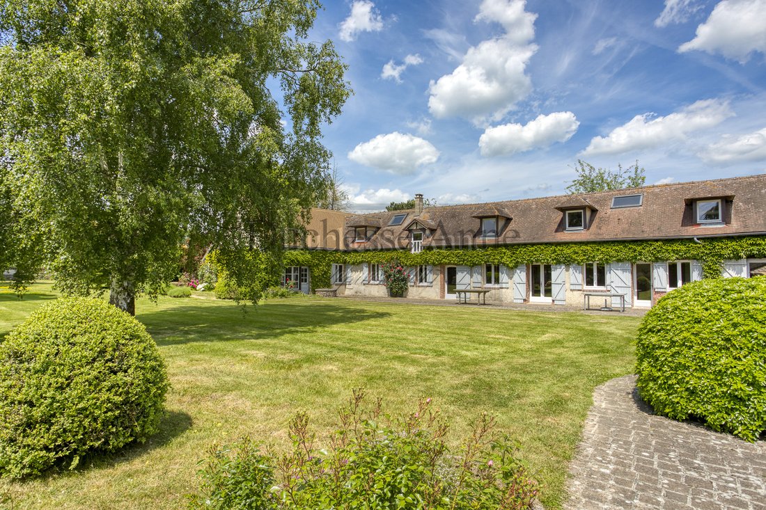Whispers of 1750: A Sunlit Haven Where Vines Embrace Stone