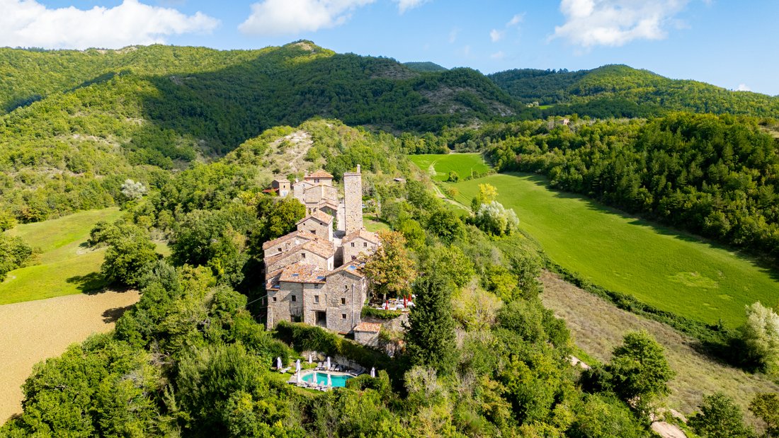 Whispers of the 12th Century: A Castle-Hamlet’s Timeless Embrace in Le Marche’s Emerald Hills