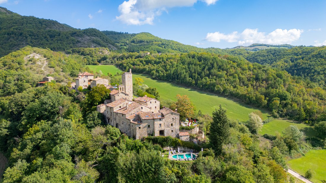 Whispers of the 12th Century: A Castle-Hamlet’s Timeless Embrace in Le Marche’s Emerald Hills