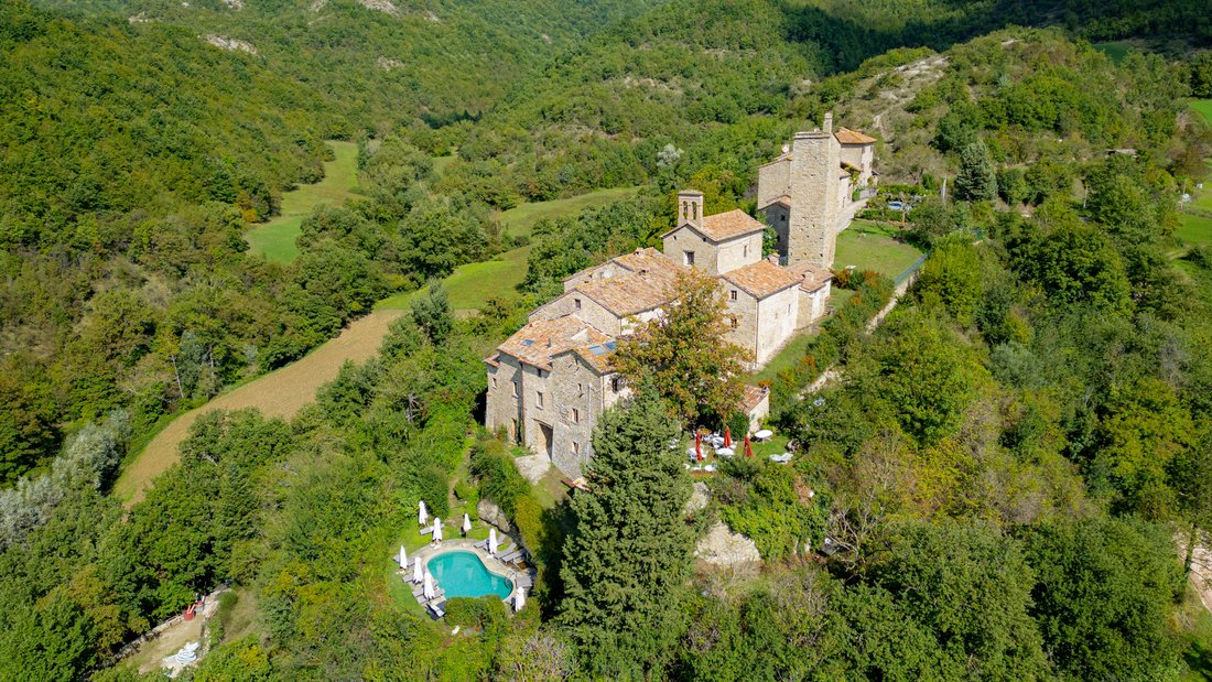 Whispers of the 12th Century: A Castle-Hamlet’s Timeless Embrace in Le Marche’s Emerald Hills