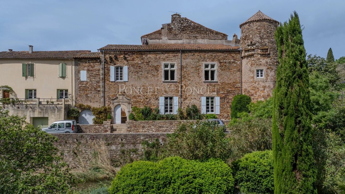 Whispers of the 13th Century: A Restored Château by Salagou’s Emerald Waters