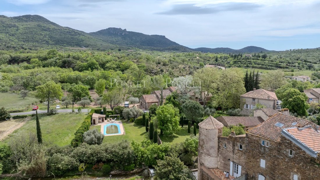 Whispers of the 13th Century: A Restored Château by Salagou’s Emerald Waters