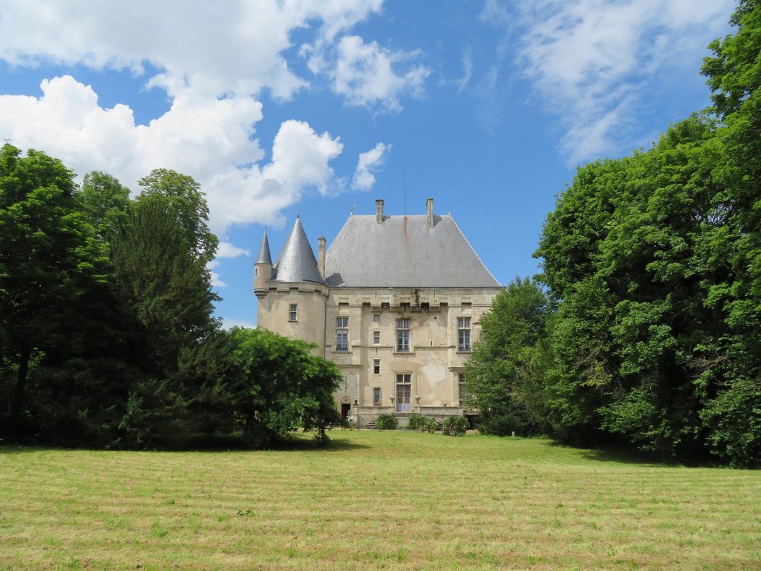 A 15th-Century Fortress of Stone & Light in Auvergne’s Golden Hills