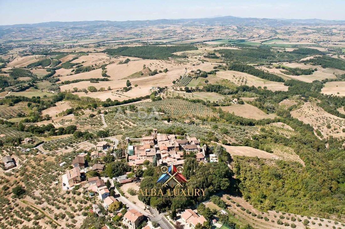 Whispers of Three Eras: A Timeless Umbrian Castle Crowned by Centuries