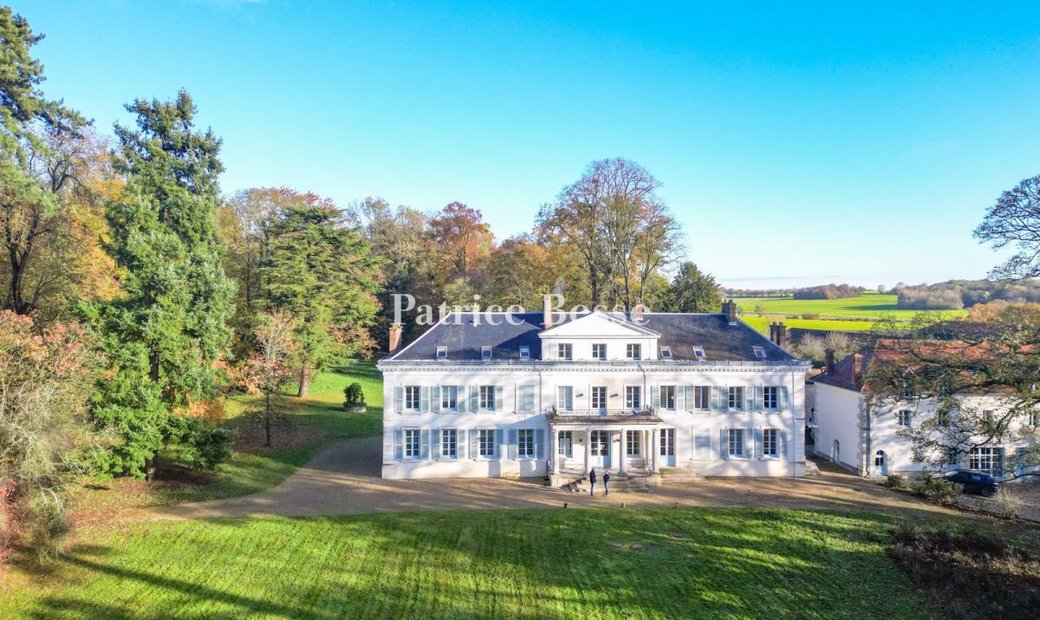 A Neo Palladian Chateau With Outhouses, Set In Nine Hectares Of Lawns And Woods Near Paris
